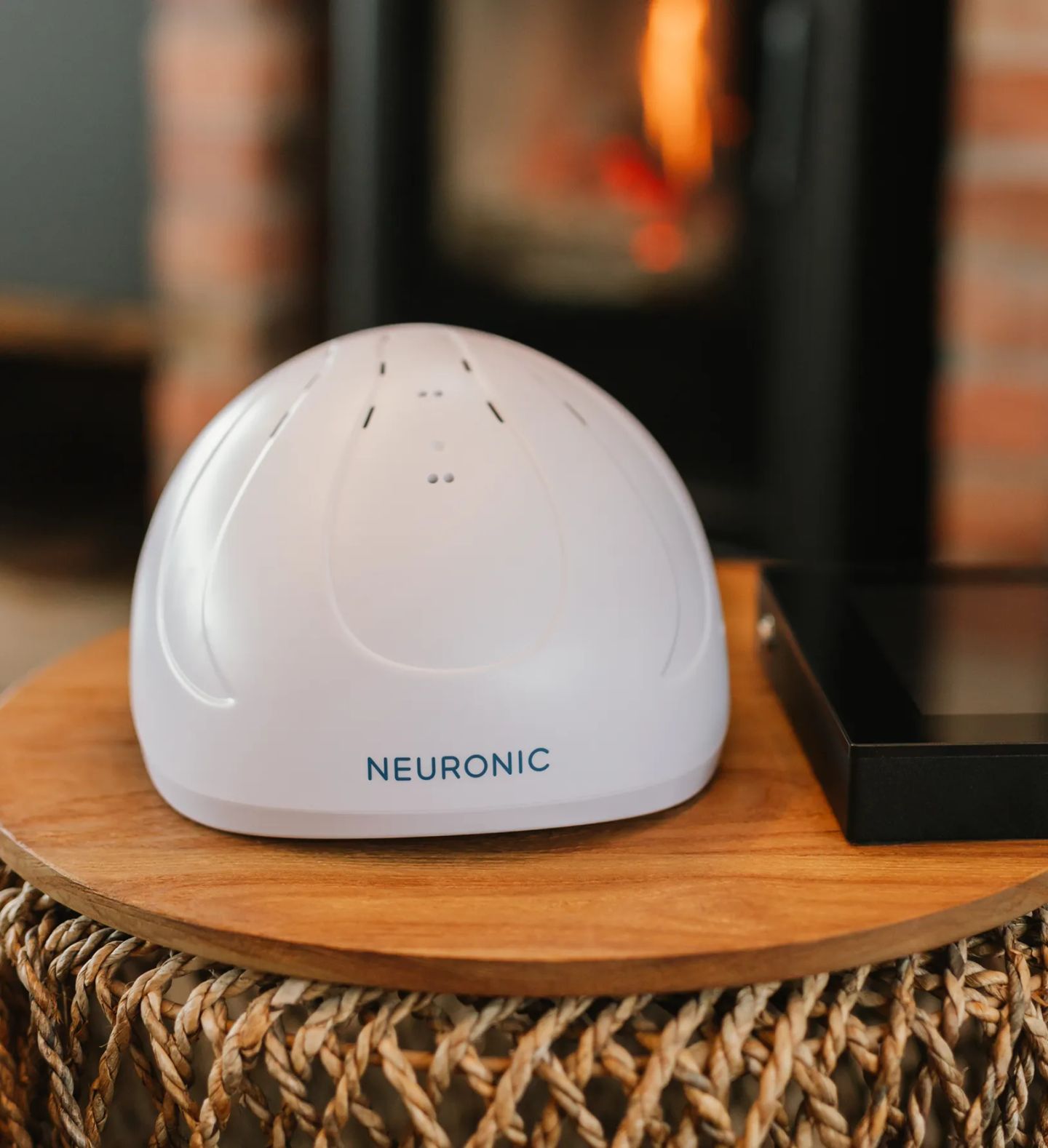 White Neuronic Neuradiant 1070 helmet on a wooden table.